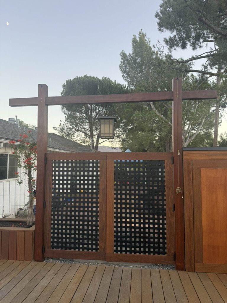 Torii-inspired gate with hanging lantern at dusk, marking entry to the dojo