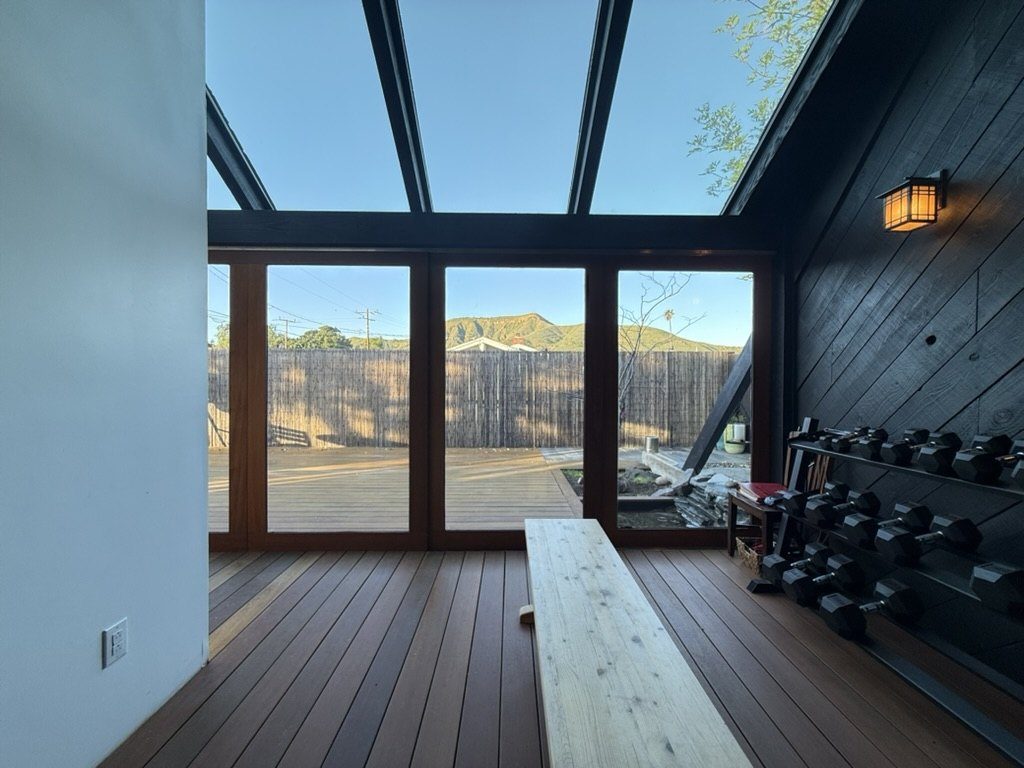 Interior view of renovated dojo with glass ceiling showing sky